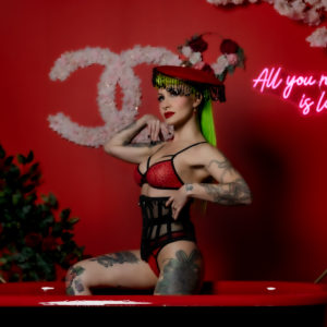 Honey sits in red tub