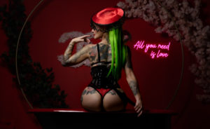 Honey sitting on red tub