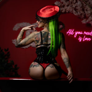 Honey sitting on red tub